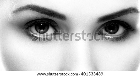 Eyes beautiful woman face studio on white close-up black and white