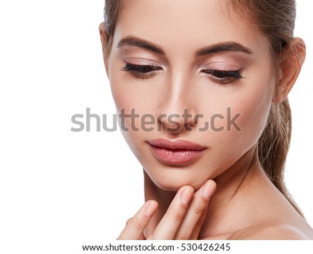 Beauty Woman face Portrait. Beautiful model Girl with Perfect Fresh Clean Skin color lips purple red. Eyes looking down