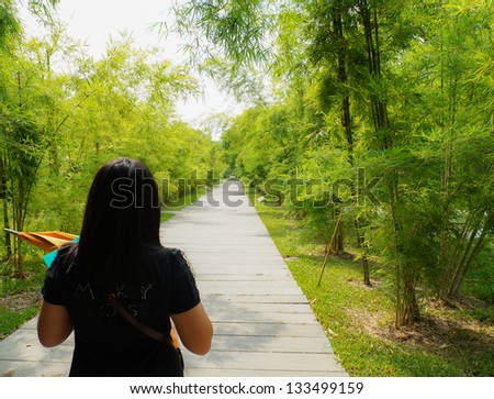 http://thumb7.shutterstock.com/display_pic_with_logo/1317430/133499159/stock-photo-asian-woman-walk-on-footpath-in-forest-alone-133499159.jpg