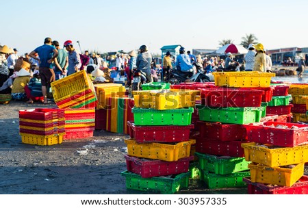 LONG HAI, VIET NAM - MAY 31 2015: People's daily life at fishing village Long Hai, they collecting fresh fishes from boat and open up a market in the early morning