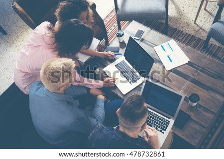 Group Young Coworkers Making Great Business Decisions.Creative Team Discussion Corporate Work Concept Modern Office.New Startup Marketing Idea Presentation.Woman Touching Digital Laptop.Top View