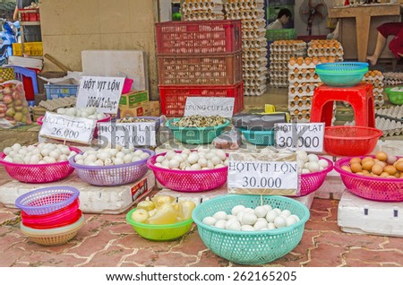 VINH LONG, VIETNAM, JANUARY 3, 2013: Different kind of eggs on display at food stalls along the street in Vinh Long market