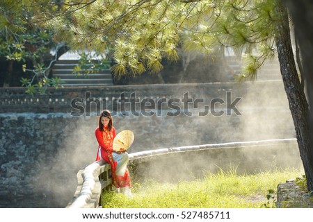 Beautiful woman with Vietnam culture traditional dress,vintage style,Vietnam