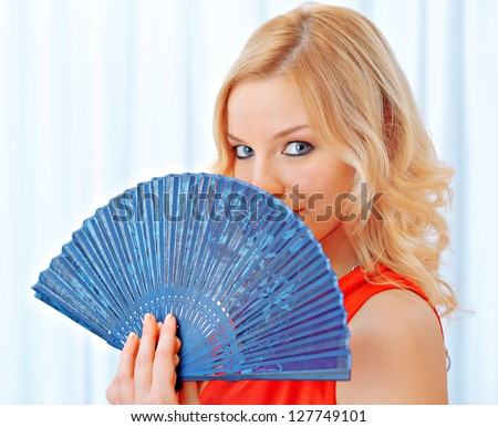 Beautiful woman with japanese fan - stock photo