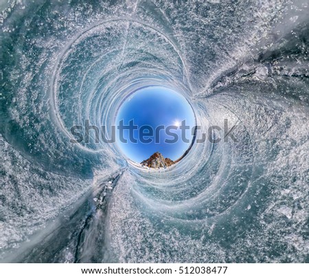 Spherical Panorama Shaman Rock or Cape Burhan on Olkhon Island in winter, surrounded by the blue ice of Lake Baikal with cracks. Spherical Panorama Shaman Rock or Cape Burhan on Olkhon Island in winter, surrounded by the blue ice of Lake Baikal with cracks.