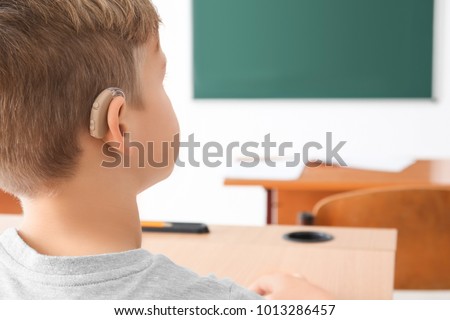 Little boy with hearing aid, closeup