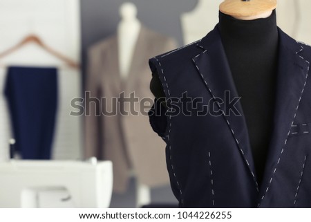Tailor's mannequin with half-made jacket in atelier