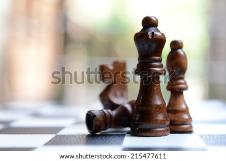 Chess board with chess pieces on light background