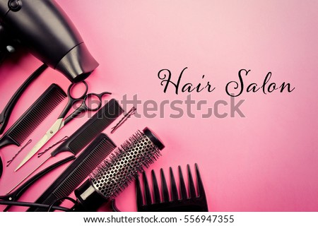 Text HAIR SALON and barber equipment on color background