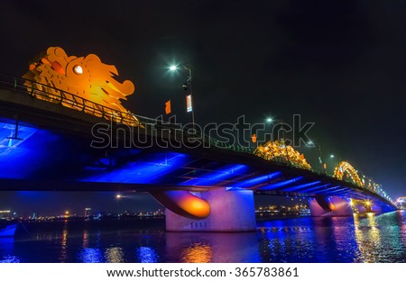 Dragon bridge, DA NANG City, Vietnam, Han River shimmering light at night
