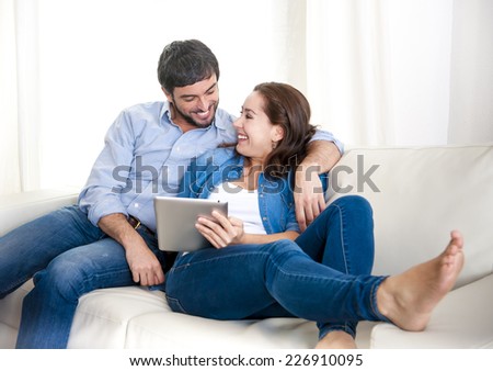 https://thumb7.shutterstock.com/display_pic_with_logo/1390159/226910095/stock-photo-young-happy-attractive-hispanic-couple-in-love-lying-together-on-living-room-sofa-couch-enjoying-226910095.jpg
