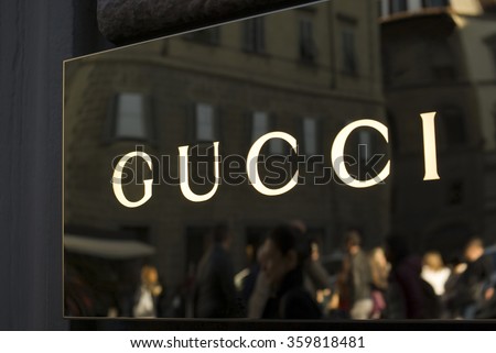 FLORENCE, ITALY - OCTOBER 31, 2015: Gucci store sign located in Via Tornabuoni, the Florence shopping street par excellence, with shops and boutiques of the most prestigious fashion brands