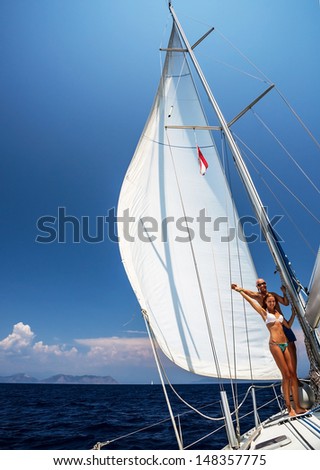 http://thumb7.shutterstock.com/display_pic_with_logo/140458/148357775/stock-photo-happy-couple-on-sailboat-young-family-enjoying-sea-cruise-on-sail-yacht-active-lifestyle-summer-148357775.jpg