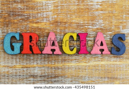 Gracias Which Means Thank You In Spanish Written With Colorful Letters On Rustic Wooden Gracias Which Means Thank You In Spanish Written With Colorful Letters On Rustic Wooden