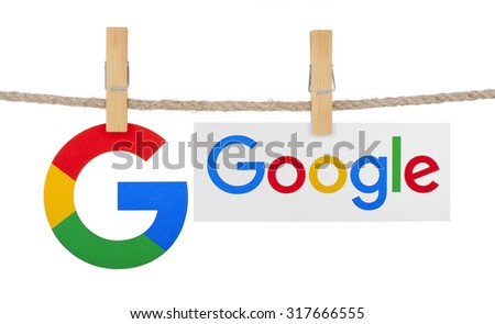 KIEV, UKRAINE - SEPTEMBER 16, 2015: Logo largest Internet search engine Google hanging on the clothesline isolated on white background.Google it is the largest Internet search engine, owned of Google