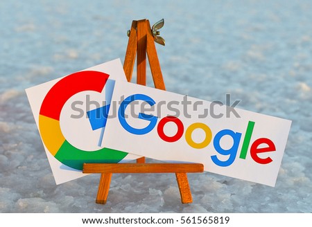 Alicante, Spain - September 18, 2016: Google icons printed on paper and placed on wooden easel. Google it is the largest Internet search engine, owned of Google.