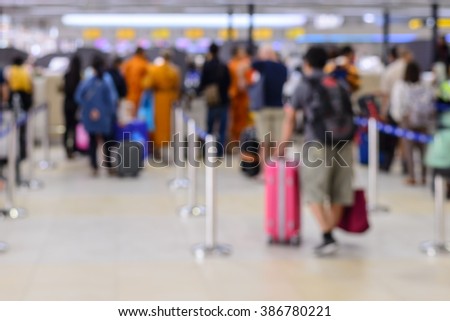 Queue of passengers check-in service at airport.