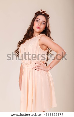https://thumb7.shutterstock.com/display_pic_with_logo/1477187/368522579/stock-photo-a-girl-in-a-short-skirt-on-a-light-background-beautiful-young-woman-beautiful-professional-368522579.jpg