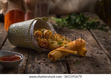 spring rolls on rustic wooden table
