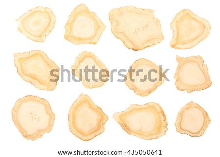 Chinese Herbal medicine - American Ginseng slices (Panax quinquefolius) on white background (manual focus)