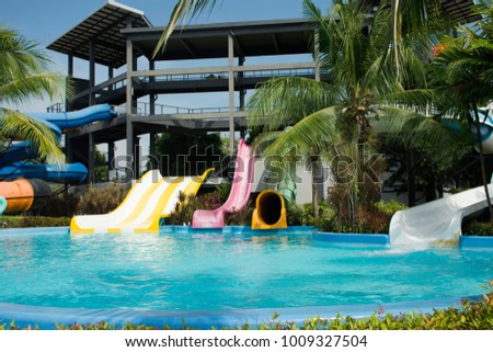 Big Slide Water And In Pool At Outdoor For People Playing Swimming Park Big Slide Water And In Pool At Outdoor For People Playing Swimming Park