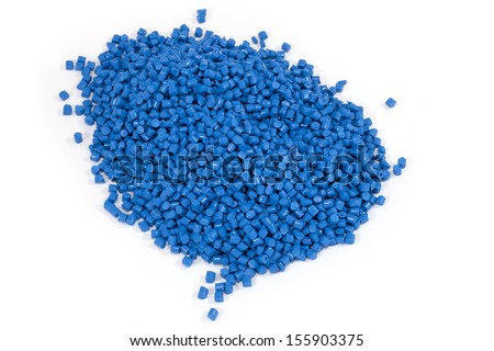 blue plastic polymer granules on white background