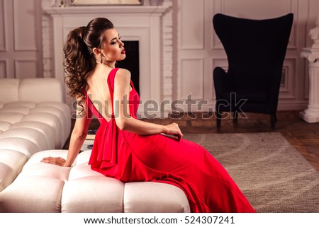 https://thumb7.shutterstock.com/display_pic_with_logo/1532018/524307241/stock-photo-young-lady-in-a-gorgeous-red-evening-dress-in-interior-524307241.jpg