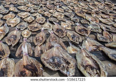 Traditional salted fish drying on racks in Semporna,Sabah,Borneo.Sea Gypsy sell their surplus catch as dried and salted fish through nearest town in Semporna,Sabah.