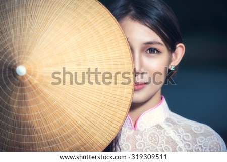 Portrait of Thai girls with Ao Dai, Vietnam traditional dress, Ao dai is famous traditional costume for woman in VIetnam.