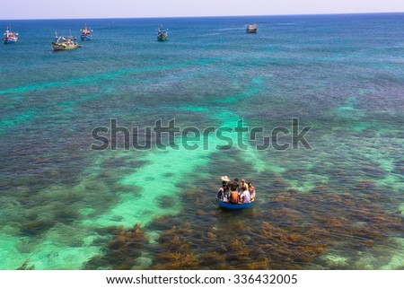 LY SON ISLAND-QUANG NGAI-VIETNAM. APRIL 26,2014. A view of fisher men on round boat in LY SON ISLAND - QUANG NGAI-VIETNAM