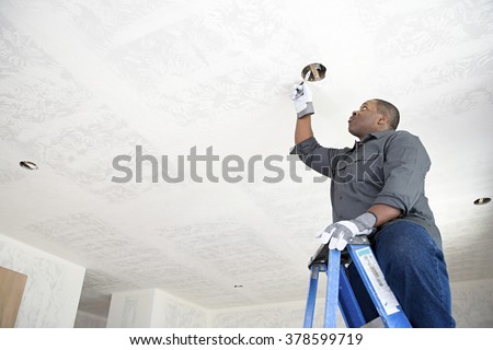 An electrician fixing wires