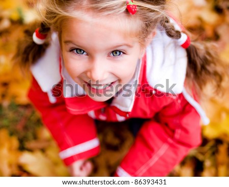 Autumn portrait of cute little caucasian girl