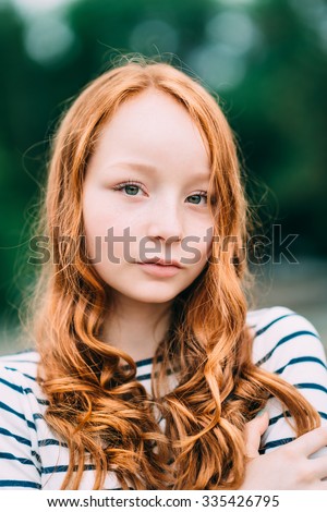 https://thumb7.shutterstock.com/display_pic_with_logo/1568183/335426795/stock-photo-an-adorable-smiling-young-woman-with-green-eyes-and-long-curly-red-hair-in-summer-park-outdoor-335426795.jpg