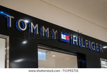 Graz, Austria - September 8th 2017: Tommy Hilfiger logo above the store entrance at Seiersberg Shopping Center
