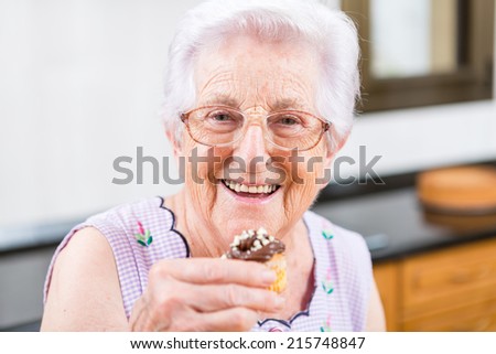 Woman Decorating Cupcakes old woman making decorating cupcakes stock photo 215748847 Woman Decorating Cupcakes old woman making decorating cupcakes stock photo 215748847
