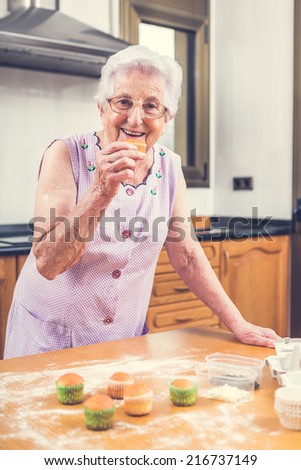 Woman Decorating Cupcakes happy elderly woman eating lunch drinking stock photo 651383044 Woman Decorating Cupcakes happy elderly woman eating lunch drinking stock photo 651383044