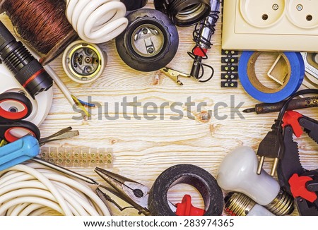 Frame tool electrician on a wooden background