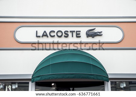 Roermond, Netherlands 07.05.2017 Logo of Lacoste Store in the Mc Arthur Glen Designer Outlet shopping area