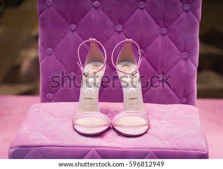 Milan, Italy - February 28, 2017: Shop window of a Gucci shop in Milan - Montenapoleone area, Italy. Few days after Milan Fashion Week. Gucci Shoes Spring Summer 2017 Collection.