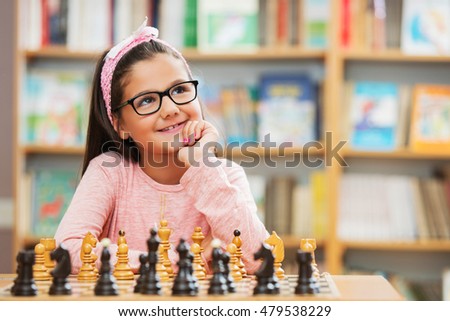 Girl play chess in school
