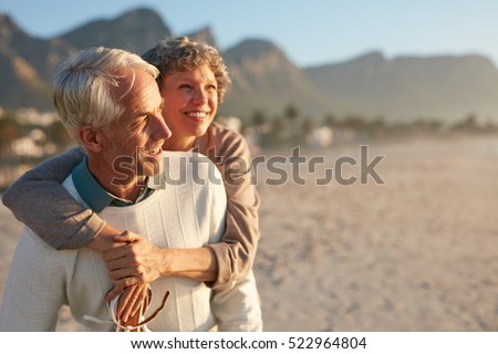 https://thumb7.shutterstock.com/display_pic_with_logo/163108/522964804/stock-photo-portrait-of-happy-mature-man-carrying-his-beautiful-wife-on-his-back-at-the-beach-senior-couple-522964804.jpg