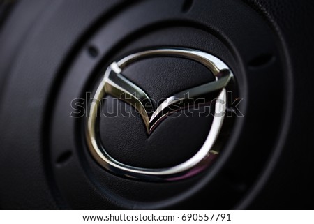 KYIV, UKRAINE - AUGUST 05, 2017: Mazda car logo on the steering wheel August 05, 2017