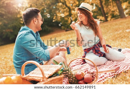 https://thumb7.shutterstock.com/display_pic_with_logo/163641428/662149891/stock-photo-picnic-time-young-couple-enjoying-picnic-in-the-park-love-and-tenderness-dating-romance-662149891.jpg
