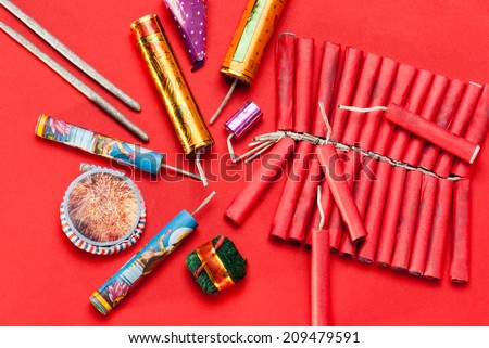 Assorted firecrackers for Diwali festival on red background