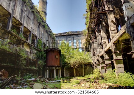 stock-photo-abandoned-destroyed-by-war-and-overgrown-machinery-of-tkvarcheli-power-plant-abkhazia-georgia-521504605.jpg