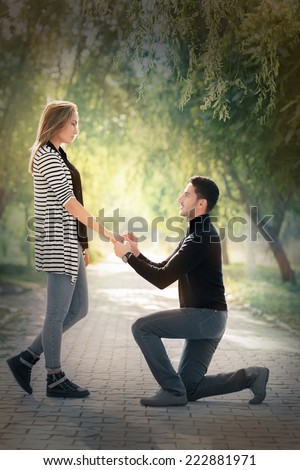 https://thumb7.shutterstock.com/display_pic_with_logo/1649021/222881971/stock-photo-kneeling-man-proposing-with-an-engagement-ring-man-proposing-marriage-with-a-romantic-gesture-222881971.jpg