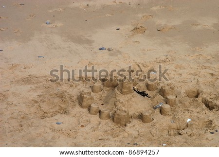 Here Is A Very Simple Sandcastle Made By Young Children With Small Buckets Here Is A Very Simple Sandcastle Made By Young Children With Small Buckets