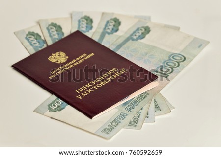 stock photo money glasses and pension certificate on a wooden surface russian translation russian pension 760592659