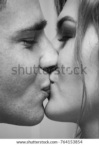 Young kissing couple people black and white photo Young kissing couple people black and white photo