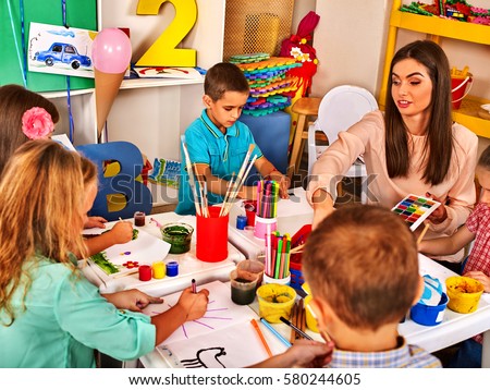 children painting and drawing in kids club craft lesson in primary school kindergarten teacher - Children Painting Images children painting and drawing in kids club craft lesson in primary school kindergarten teacher - Children Painting Images